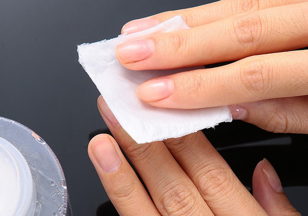 Disposable cotton pad to remove nail polish